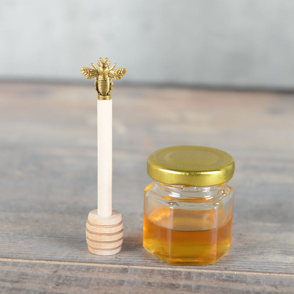 Gouden honinglepel bijen